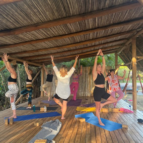 Karen Lynn leading a yoga session at a retreat in Costa Rica